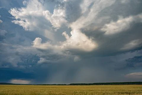 Massive dark storm clouds producing heavy rainfall Foto stock