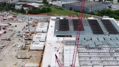 Massive data center construction site in Lancaster with tall red tower crane Stock Footage 337529053