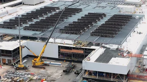 Massive data center under construction with dense rows of rooftop cooling Video stock 337691811