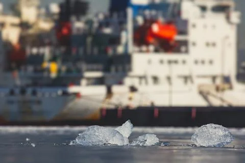 Massive different ship vessels trapped in ice tries to break and leave the ba Stock-Fotos