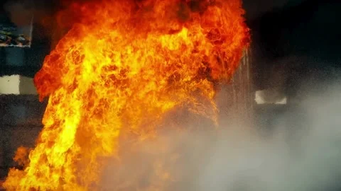 Massive fire blast and explosion with heavy smoke rising from building Stock Footage 333484652