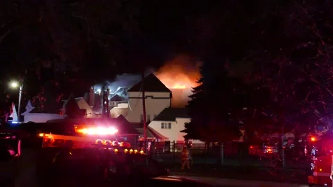 Massive fire during windy night Stock Footage 139657137