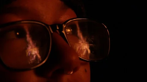Massive fire reflects off kid's glasses Stock Footage 122307093
