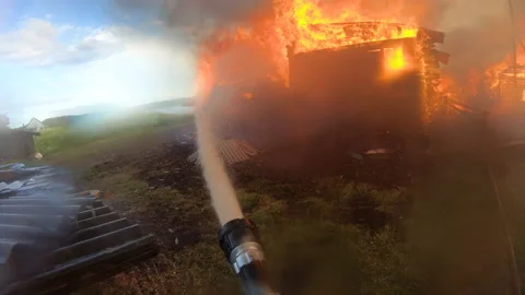 Massive fire in the village.Work of firefighters. Stock Footage 139412534