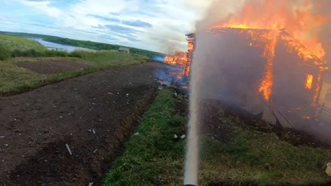 Massive fire in the village.Work of firefighters. Stock Footage 139412688