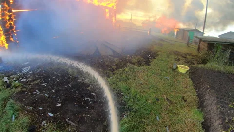 Massive fire in the village.Work of firefighters. Stock Footage 139412784