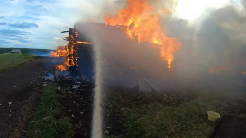 Massive fire in the village.Work of firefighters. Stock Footage 139412870