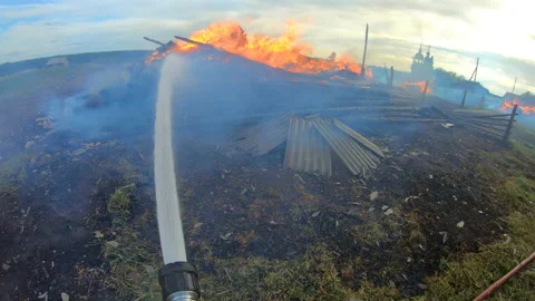 Massive fire in the village.Work of firefighters. Stock Footage 157558043