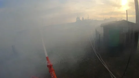 Massive fire in the village.Work of firefighters. Stock Footage 157558086