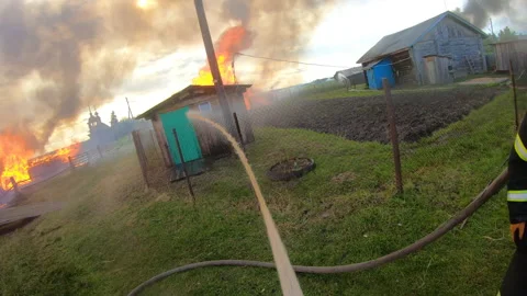 Massive fire in the village.Work of firefighters. Stock Footage 157558368