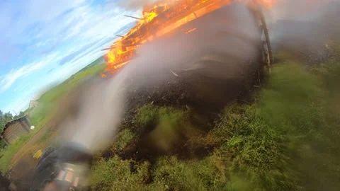 Massive fire in the village.Work of firefighters. Stock Footage 157558506