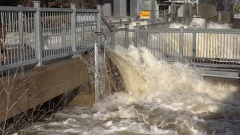 Massive flooding and raging river as tow... | Stock Video | Pond5
