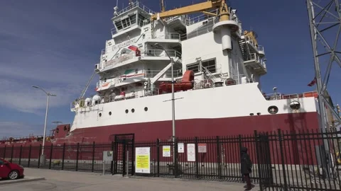 Massive freighter cargo container ship sailing the Welland canal Stock Footage 153342616
