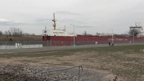 Massive freighter cargo ship sailing up the Welland canal Видео 152073609