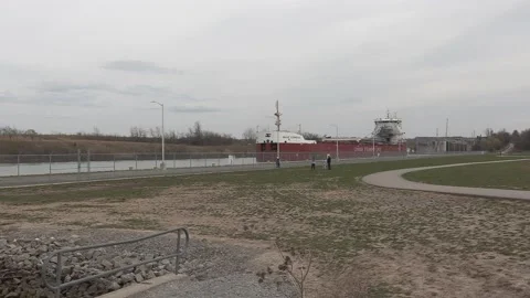 Massive freighter cargo ship sailing up the Welland canal Stockbeeldmateriaal 152073804