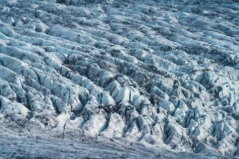 Massive glacier texture background, long shot with cracks Stock Photos