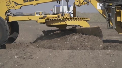 Massive heavy machine is moving the soil around, construction vehicle Stock Footage 160115290