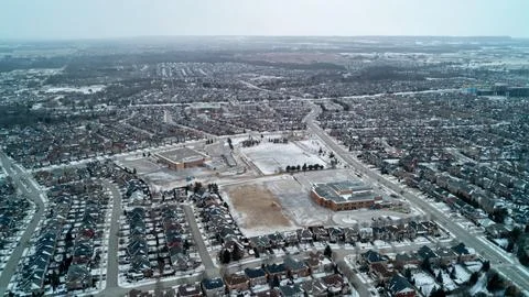A massive high-angle drone photograph capturing a vast suburban housing devel Fotos de archivo