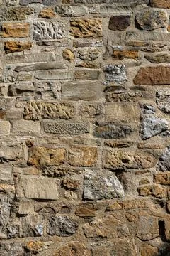 Massive high walls of an old medieval castle Stock Photos