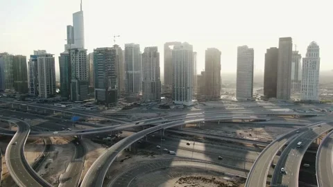 Massive highway intersection in Dubai, lots of traffic and a view on skyscrapers Stock Footage 152886219