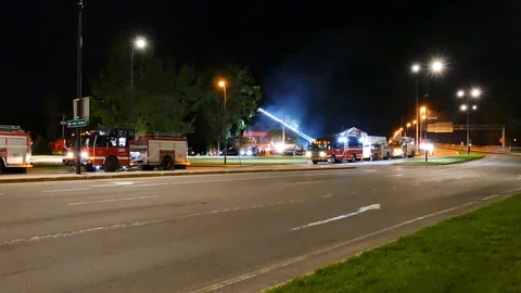 Massive house fire with firetrucks Stock Footage 114768480