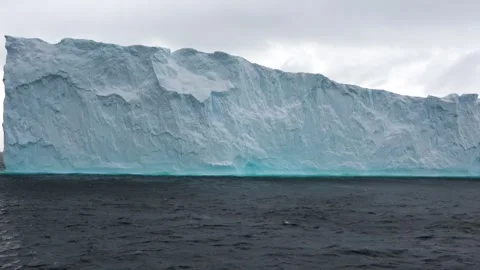 Massive iceberg drifting wide ocean Antarctica, 4K Stock Footage 332371552