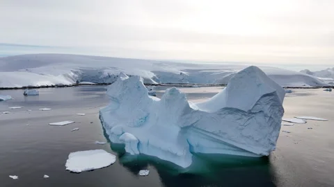 Massive iceberg floating in the arctic ocean Stock Footage 320564105