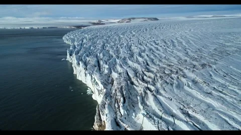 Massive iceberg floating in the serene waters of a fjord. Stock Footage 297870185