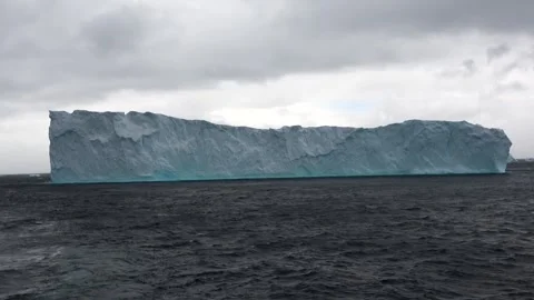 Massive iceberg full wide composition Antarctica ocean, 4K Stock Footage 332371553