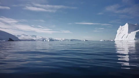 Massive Iceberg Rising Above Calm Antarctic Waters Видео 343372697