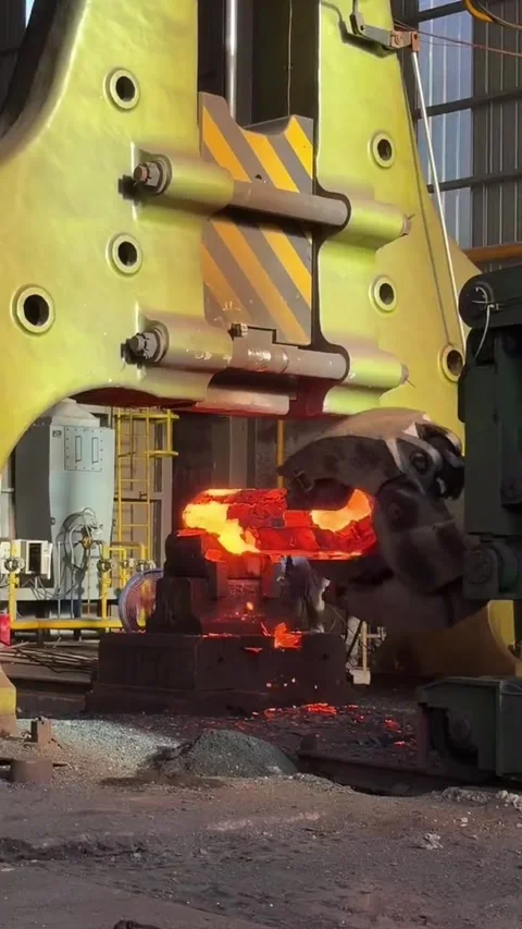 Massive Industrial Forging Press Shaping Red Hot Metal in a Steel Factory China Stock Footage 339203401