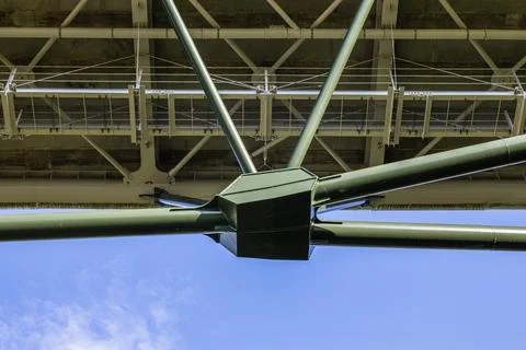 Massive industrial steel construction structure of the bridge Stock Photos