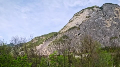 Massive Karwendel limestone cliff and spring foliage near Austria–Germany border Stock Footage 320888241