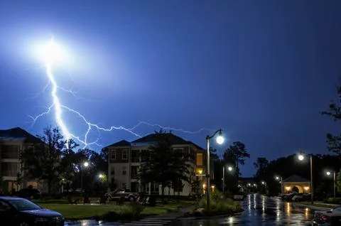 Massive  Lightning Strike during a summer rain storm Stock Photos