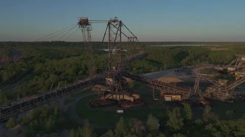 Massive Lignite Stacker at Sunset – Aerial View of Leipzig’s Post-Mining Stock Footage 309958180