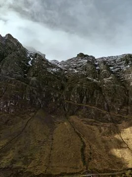 Massive mountain range on cloudy day Stock Photos
