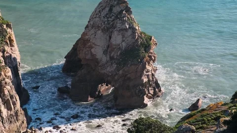 Massive mountain stone rocks sticking out sea ground. Atlantic ocean coastline Stock Footage 273794609