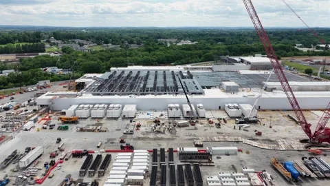 Massive new data center under construction with large red crane, steel Stock Footage 336793880