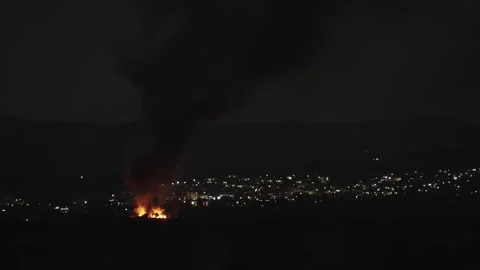Massive Night Fire Engulfs City, Producing Dense Smoke &amp; Air Pollution Video stock 332072948