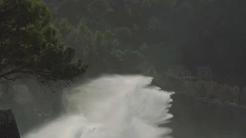 Massive ocean spray hitting cliffs of Mediterranean coast Stock Footage 168774249