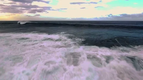 Massive Ocean Wave Crashing into Thick Sea Foam on the Coast Stock Footage 319804768