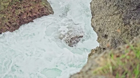 Massive Ocean Waves Crashing Between Solid Coastal Rock Formations Stock Footage 296570576