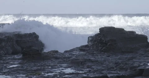 Massive Ocean Waves Exploding Over Rocky Formation Stock Footage 328201551