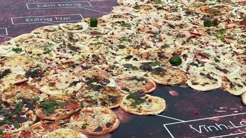 Massive Pizza Installation on the ground arranged Vietnam Map Shape at Food Stock Footage 342699393