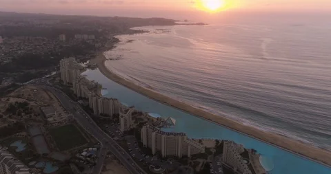 Massive Pool and Beach and Ocean at Sunset ‚ Aerial View Stock Footage 103738100