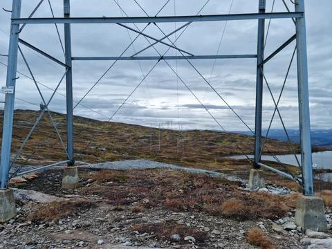 Massive power line structure on mountain, closeup of base Stock Photos