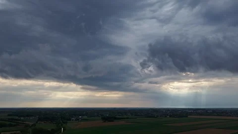 A massive, powerful summer storm looms over vast fields Stock Footage 339382553