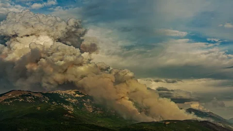Massive pyrocumulus cloud rising above Monte Morrone during wildfire Stock Footage 342749368