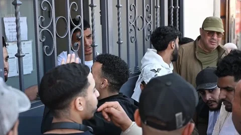 Massive queues at the Moroccan Consulate in Almería for the regularization of mi Stock Footage 332728123