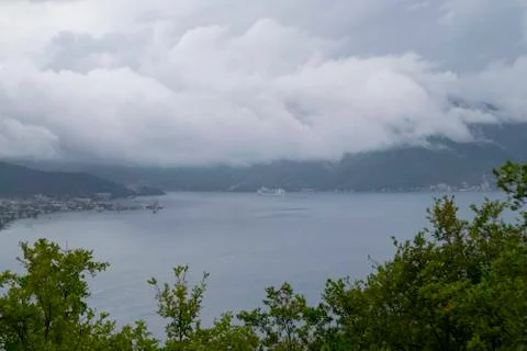 Massive rain clouds lie down on the Bay of Kotor, Adriatic Sea, Montenegro. Foto stock